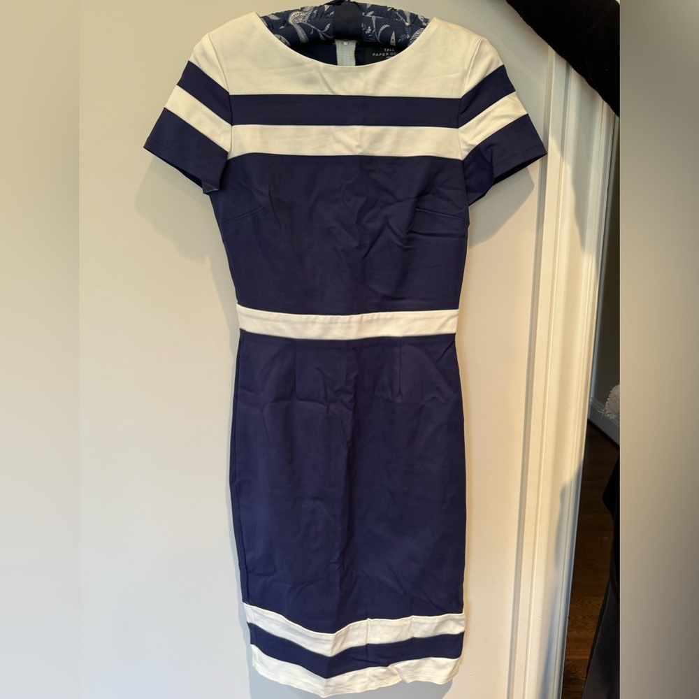 Tall Paper Dolls, London. Blue and white striped dress.